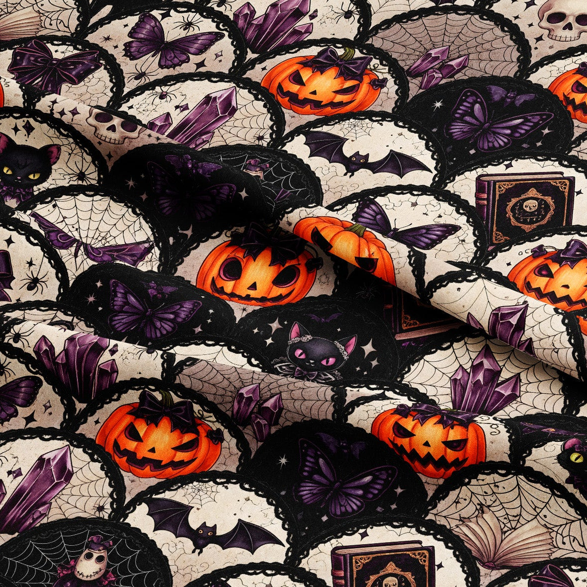 A close-up of a Halloween-themed fabric featuring a repeating pattern of black cats, purple butterflies, orange jack-o'-lanterns, bats, skulls, and spiderwebs on a black and off-white background.