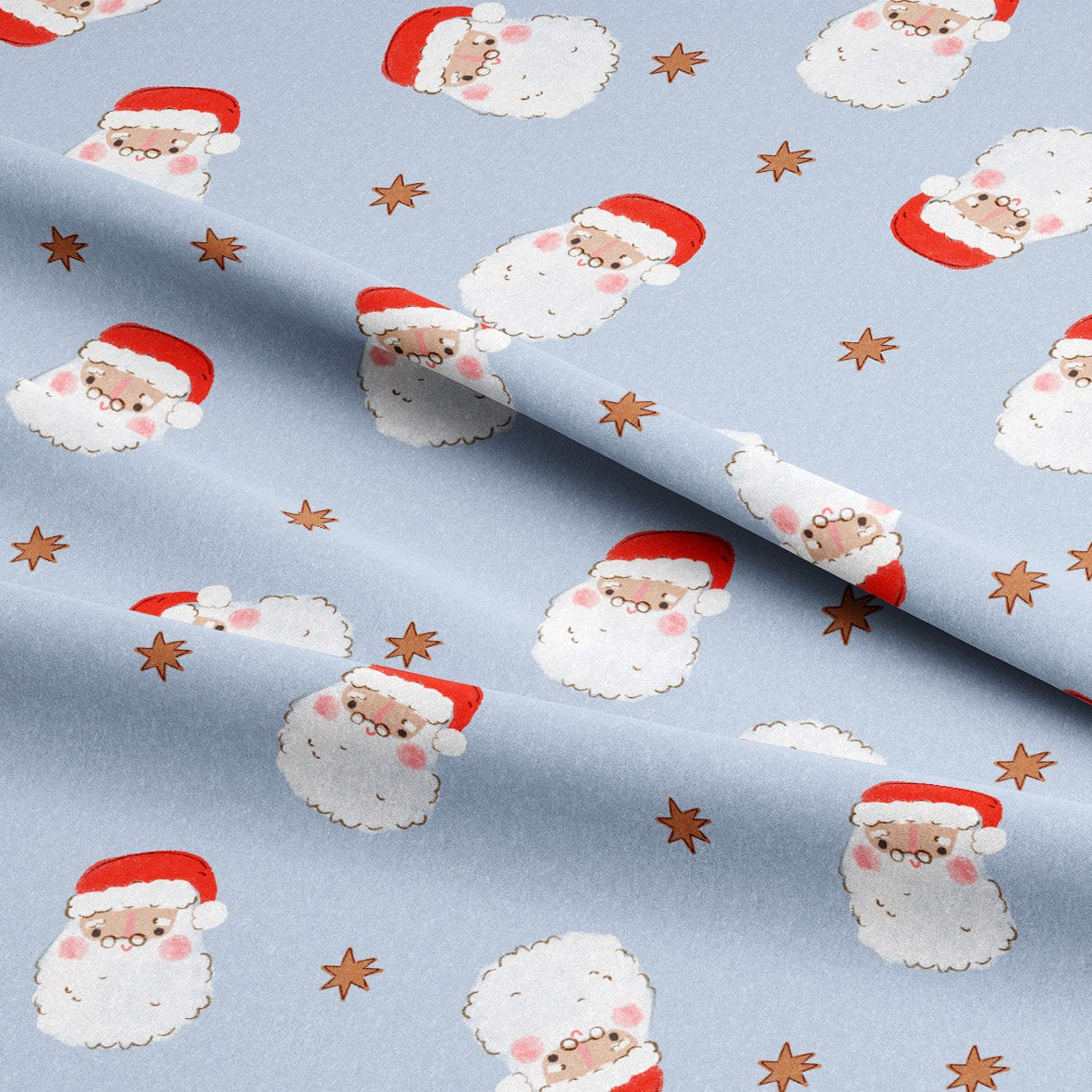 Light blue fabric with a repeating pattern of cute Santa Claus faces wearing red hats, accented with small brown star shapes.