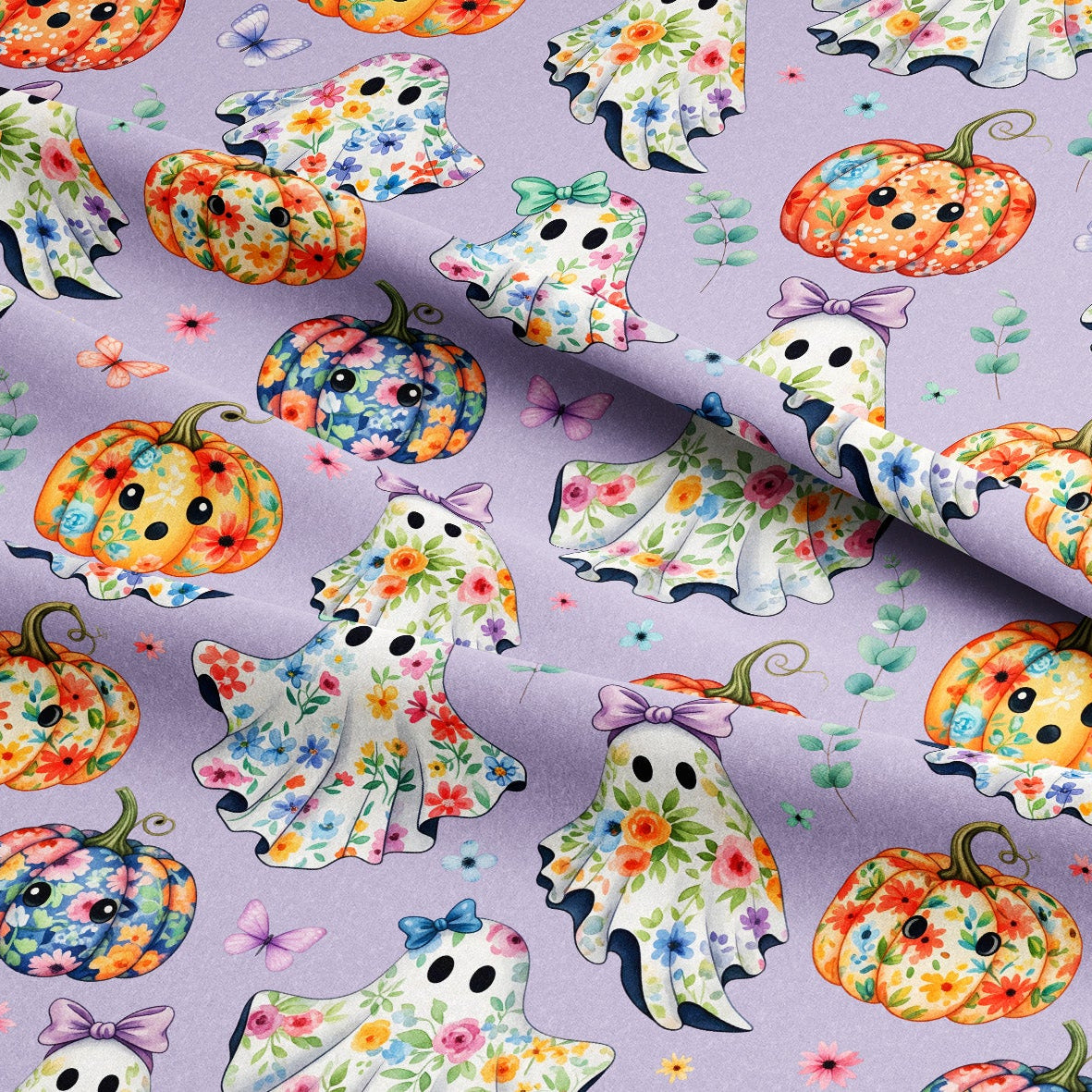 Lavender purple fabric with a repeating Halloween pattern of colorful floral ghosts and pumpkins, with a folded corner showing the texture.