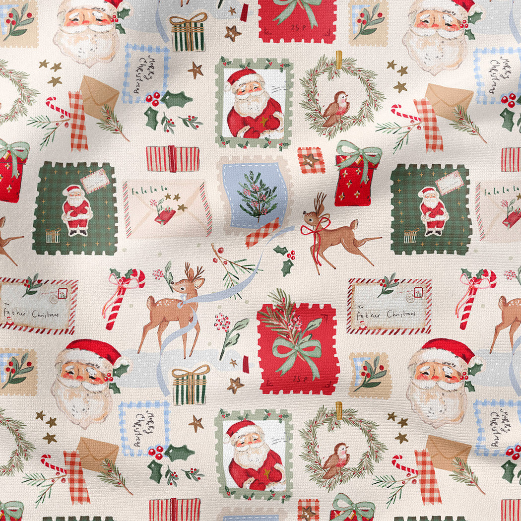 A festive Christmas-themed fabric print featuring Santa Claus, reindeer, wreaths, candy canes, stockings, and holiday postmarks on a cream background.