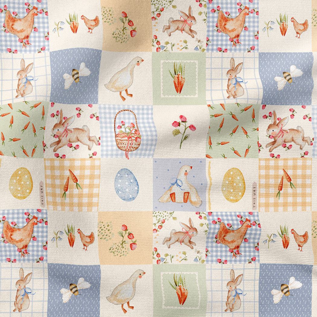 Patterned fabric with Easter-themed illustrations including chickens, bunnies, eggs, and carrots on a grid background.