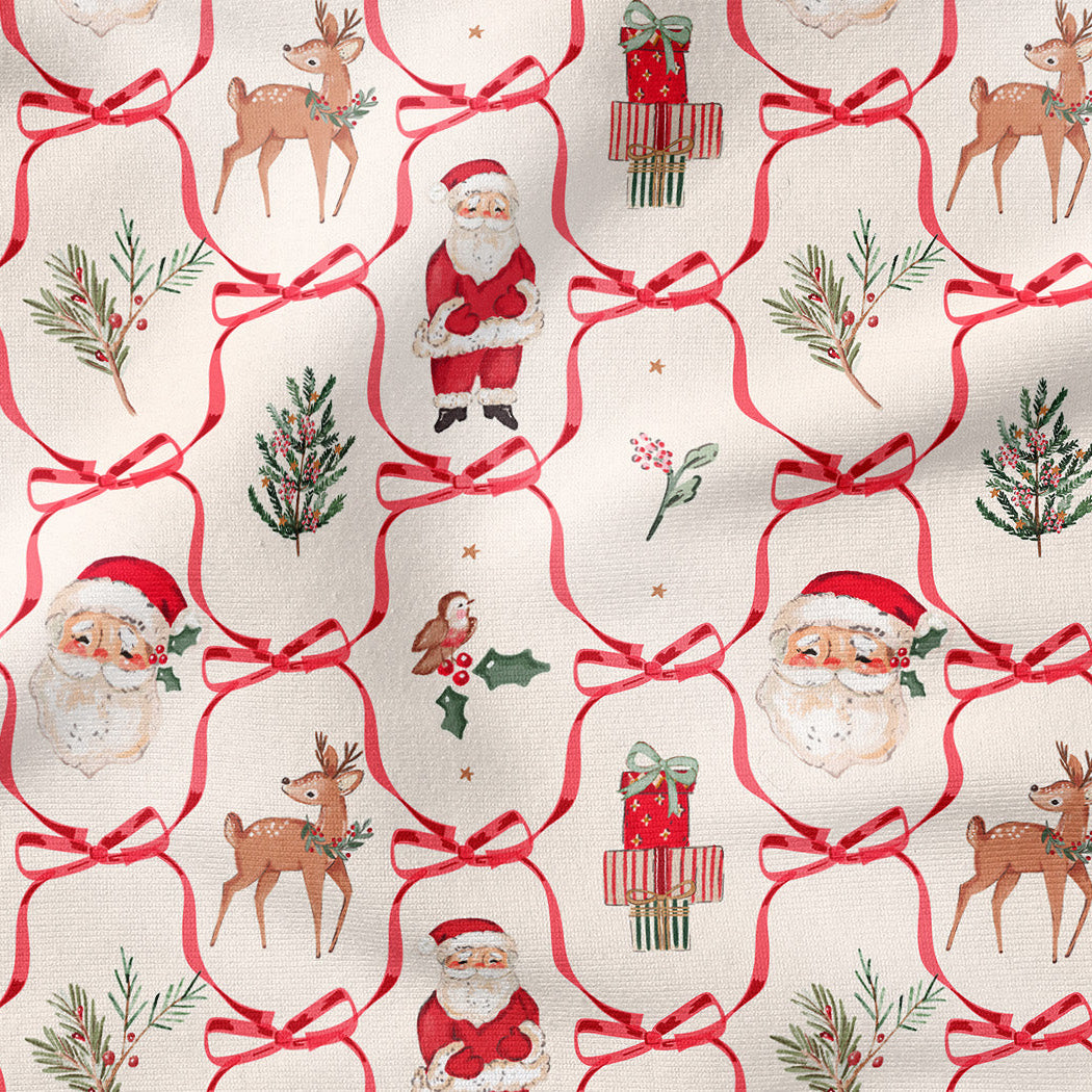 A close-up of a Christmas-themed fabric pattern featuring Santa Claus, reindeer, gifts, holly, pine branches, and red bows on an off-white background.