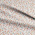 Floral patterned fabric with small flowers and leaves on a white background