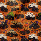 Halloween-themed monster truck pattern on orange fabric, featuring black, white, and green monster trucks, jack-o'-lanterns, ghosts, bats, and candy motifs.
