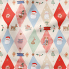 A festive Christmas-themed fabric pattern featuring a repeating harlequin diamond design with Santa Claus, snowman, reindeer, Christmas trees, gifts, and 'Merry Christmas' banners on a cream background.