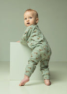 Baby wearing giraffe print jersey top