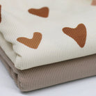 Beige heart patterned ribbed jersey fabric