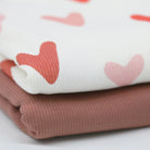 Pink hearts on ribbed jersey fabric