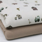 Farm animals print fabric with cows, pigs, sheep, and tractors