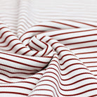 Close-up of Bordeaux striped ribbed jersey fabric