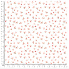 Pink floral pattern on cotton jersey fabric with ruler for scale