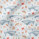 Whale and sea life fabric with marine animals and shells