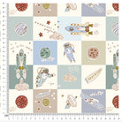 Close-up of space-themed quilt fabric with astronaut, rocket, planets, and adventure design in pastel shades