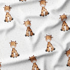 Pattern of cartoon giraffes on a white fabric background