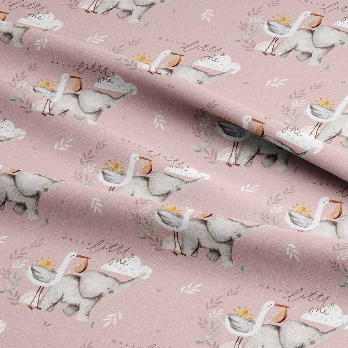 Pink fabric with a repeating pattern of white storks carrying baskets, small gray elephants, and delicate leafy branches, with the words 'little one' in script.