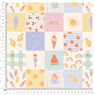 Close-up of colorful summer-themed patchwork fabric with ice cream, cherries, lemons, and rainbows