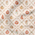A repeating fabric pattern featuring watercolor-style pumpkins and pears in muted orange, peach, cream, and olive tones, arranged in a diamond lattice with small floral garlands and bows on a warm off-white background.