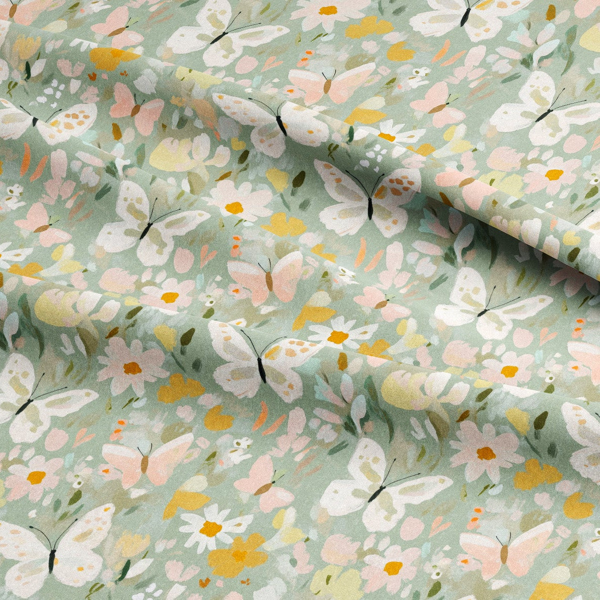 Fabric with a pattern of butterflies and flowers on a light green background