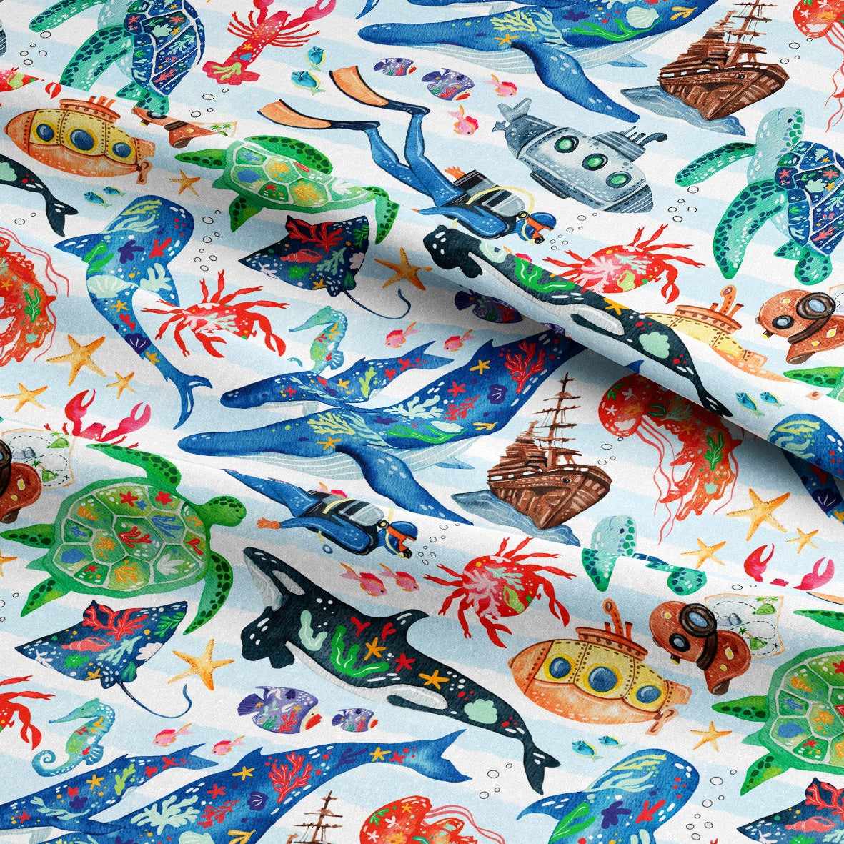Colorful fabric with sea-themed pattern featuring various marine animals and ships.