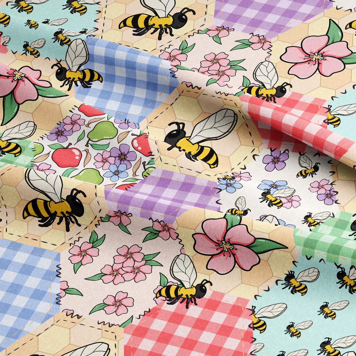 Fabric with bees, flowers, and checkered patterns in a patchwork design.