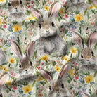 Pattern of rabbits and flowers on a fabric background