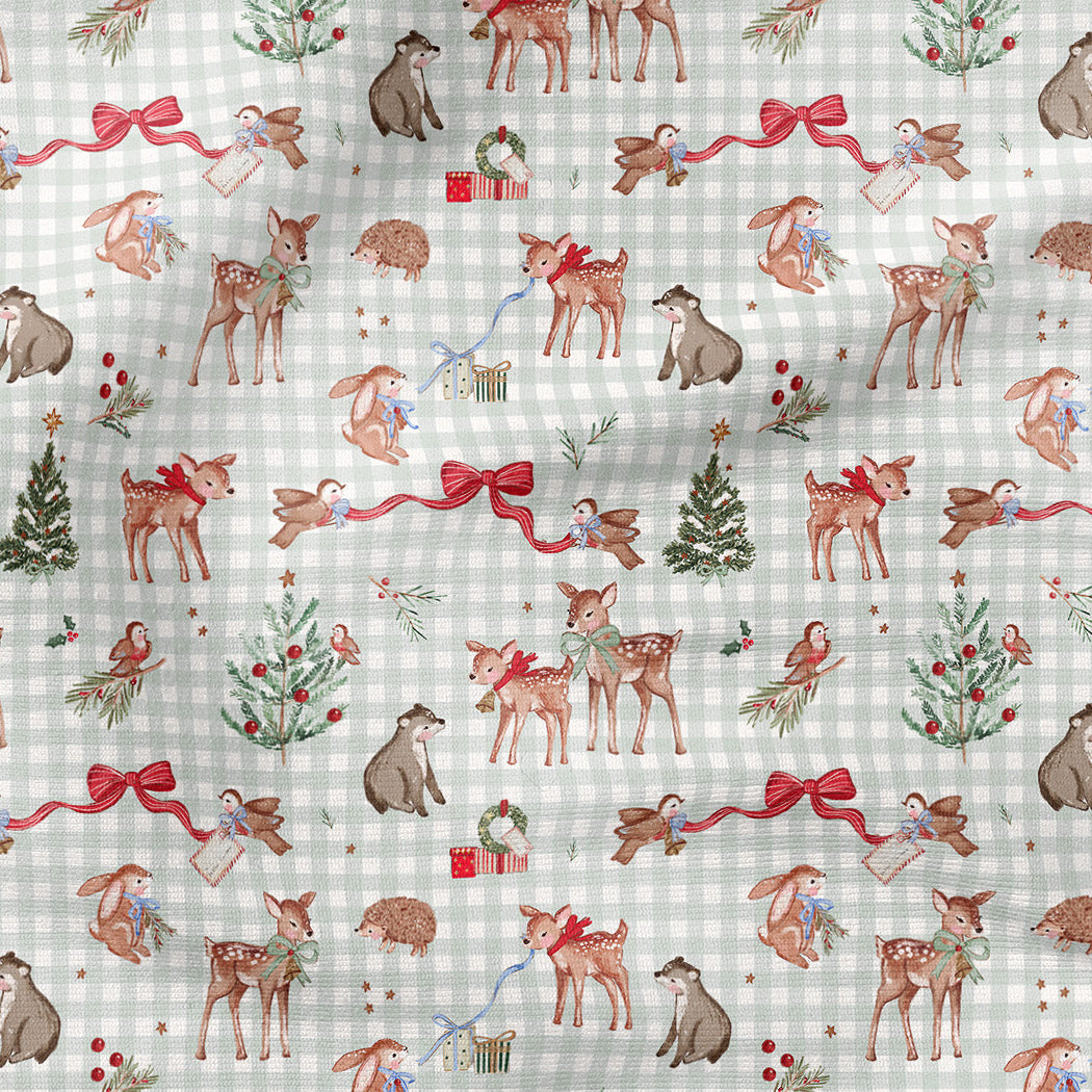 A festive Christmas-themed fabric pattern featuring watercolor illustrations of deer, dogs, cats, Christmas trees, and red bows over a light gray and white gingham background.