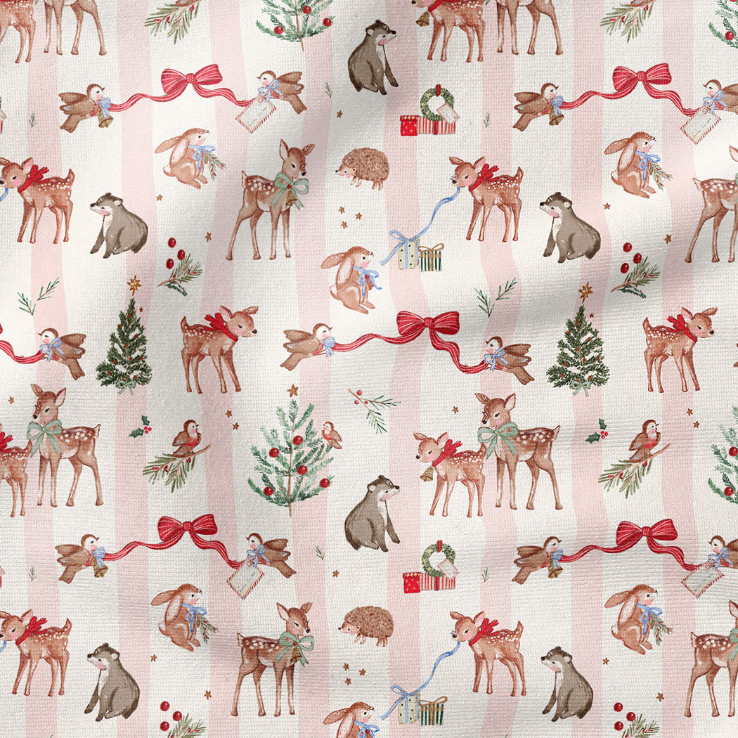 A repeating Christmas-themed pattern featuring deer, dogs, cats, hedgehogs, birds, evergreen trees, wreaths, and red ribbon bows on a pale pink striped background.